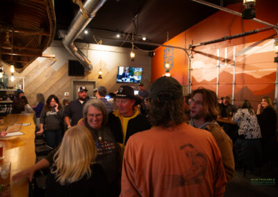 People enjoying a drink at the bar during the opening of Pale Fire Brewing Co in Basye, VA.